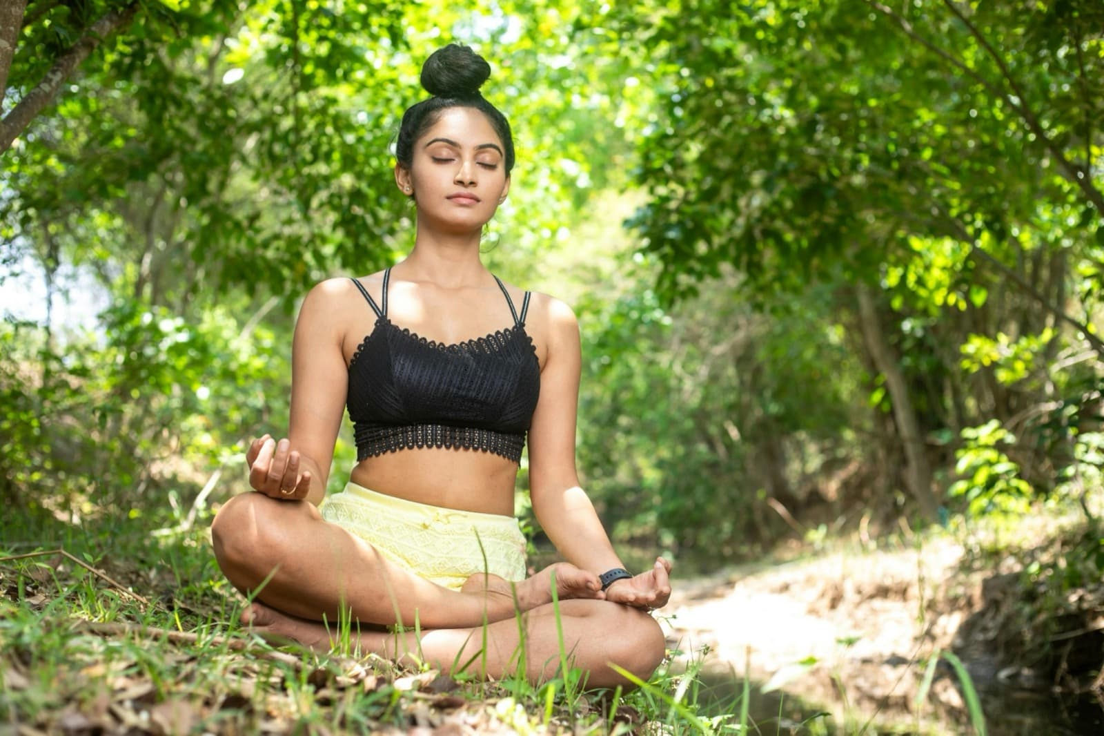 Woman meditating outdoors in nature